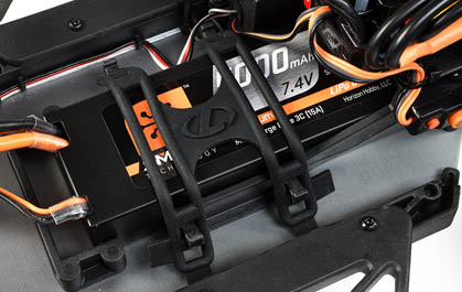 Elastomer Battery Straps and Adjustable Battery Position